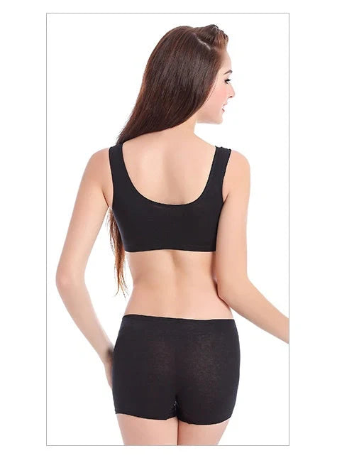 Supportive and comfortable cotton sports bra with crossover design for bust enhancement and posture support during workouts