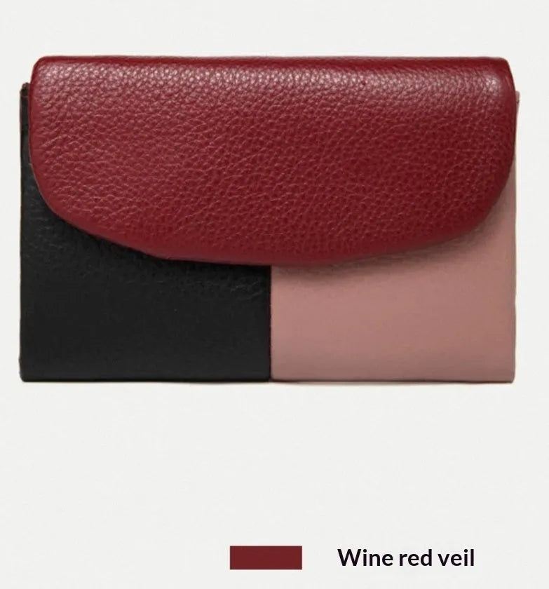 Women's short wallet in soft leather texture with solid colour and stitching detail, urban minimalist style