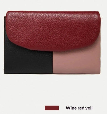 Women's short wallet in soft leather texture with solid colour and stitching detail, urban minimalist style