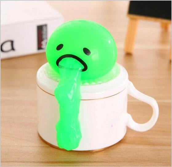 Gudetama Vomiting Egg Toy in green, orange, pink, and yellow for stress relief and fun