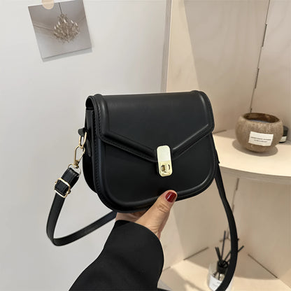 Soft PU leather messenger bag with clamshell opening in black, dark brown, khaki or white.