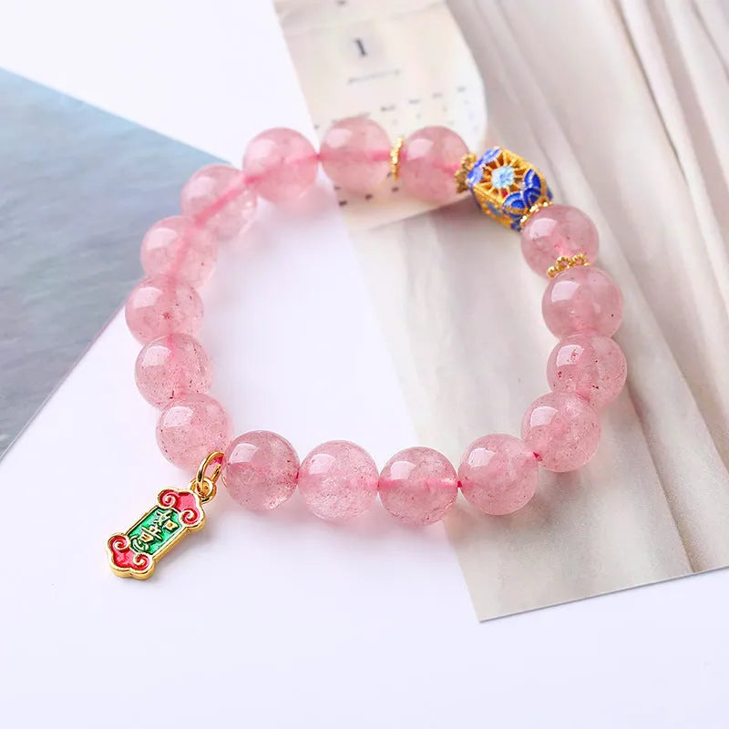 Pink strawberry quartz crystal bracelet with Ruyi charm, hand-woven in a national style.