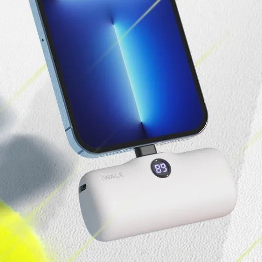 Compact lipstick-style power bank showing screen display with battery percentage, measuring 78mm x 51mm x 25mm