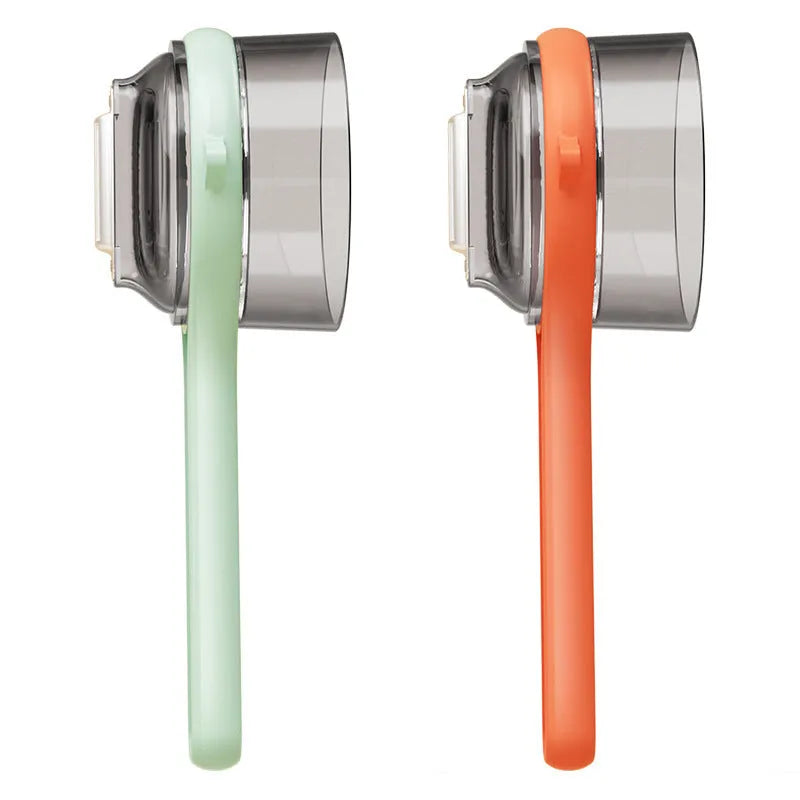 Light green kitchen peeler with an integrated storage bucket for collecting fruit and vegetable peel.
