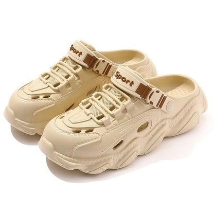 Men's khaki outdoor slippers with hollow-out design and textured EVA sole on a wooden deck