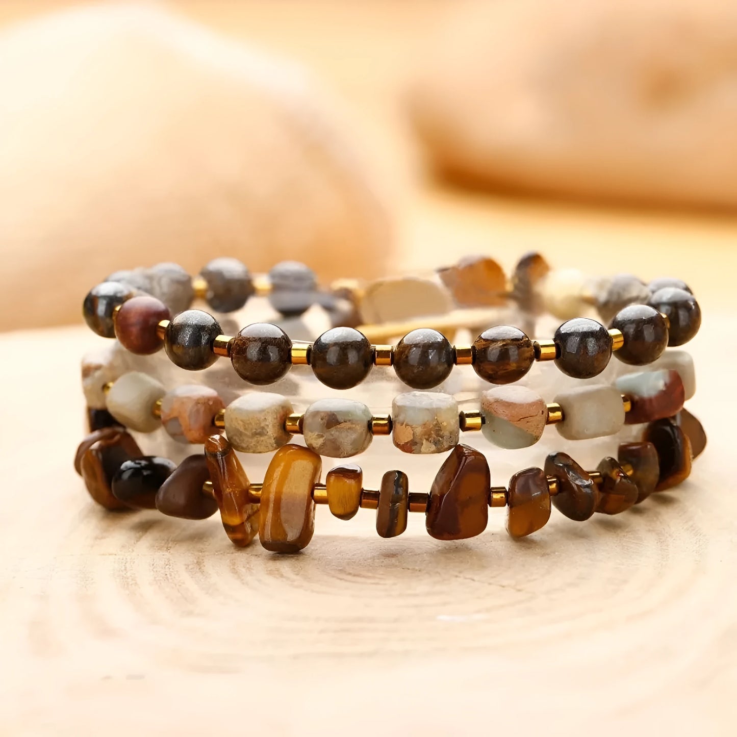Brown geometric tigereye and bronze bracelet with textured bends and hitches detailing