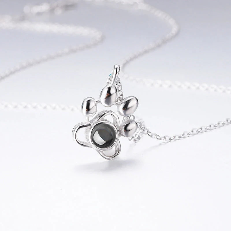 Custom dog paw projection necklace in silver with adjustable chain
