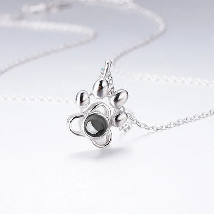 Custom dog paw projection necklace in silver with adjustable chain