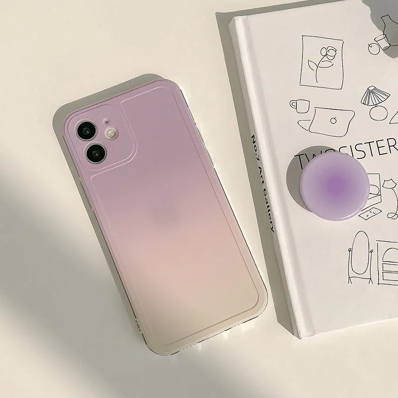 Yellow to purple gradient silicone iPhone case with a pop-out kickstand deployed.
