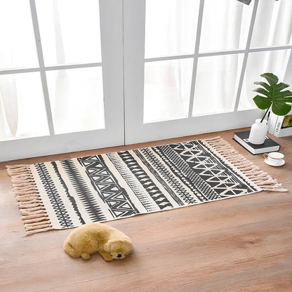 Hand-woven Scandinavian style linen cotton rug with woven tassels in plant-dyed colours measuring 60x90cm