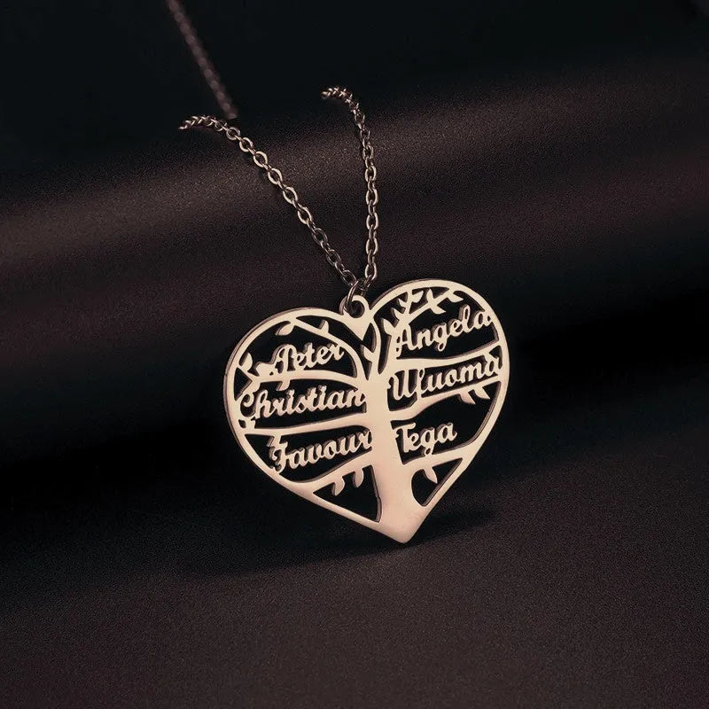 Custom stainless steel name necklace with hollow heart tree pendant in gold, rose gold, or silver on a chain.