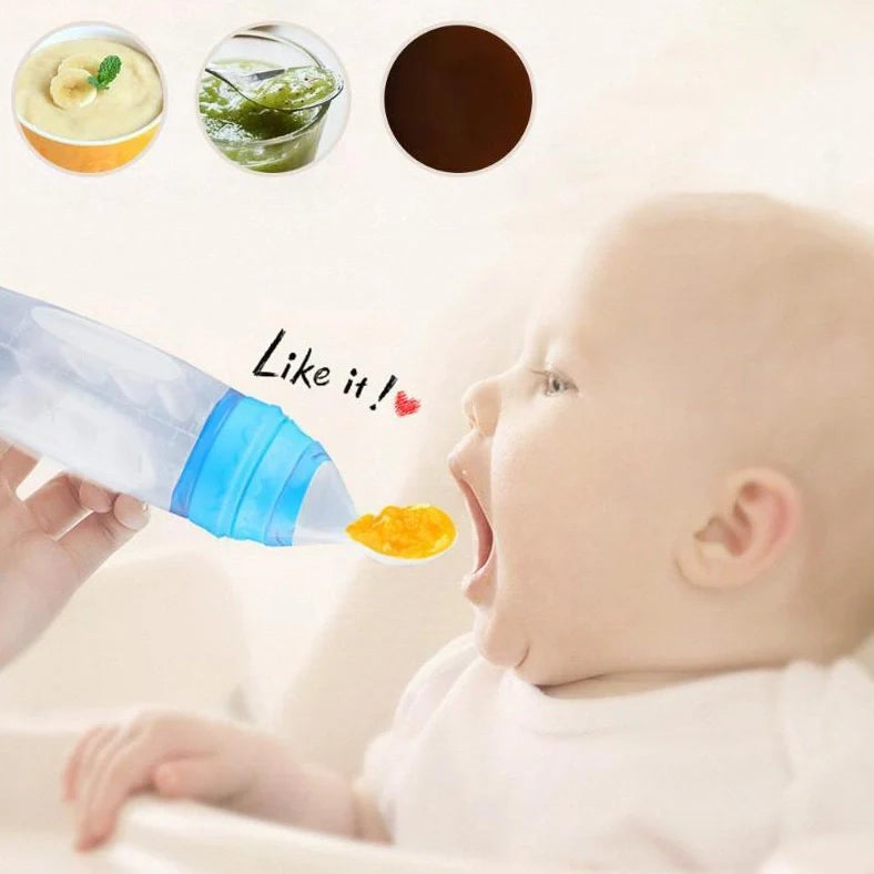 Blue silicone baby feeding spoon with squeeze mechanism, 19.5cm length