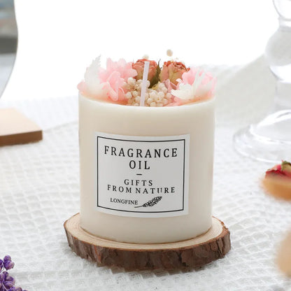 Aromatherapy candle with dried flowers on a wooden chip base, showing blue campanula and lavender scent options.