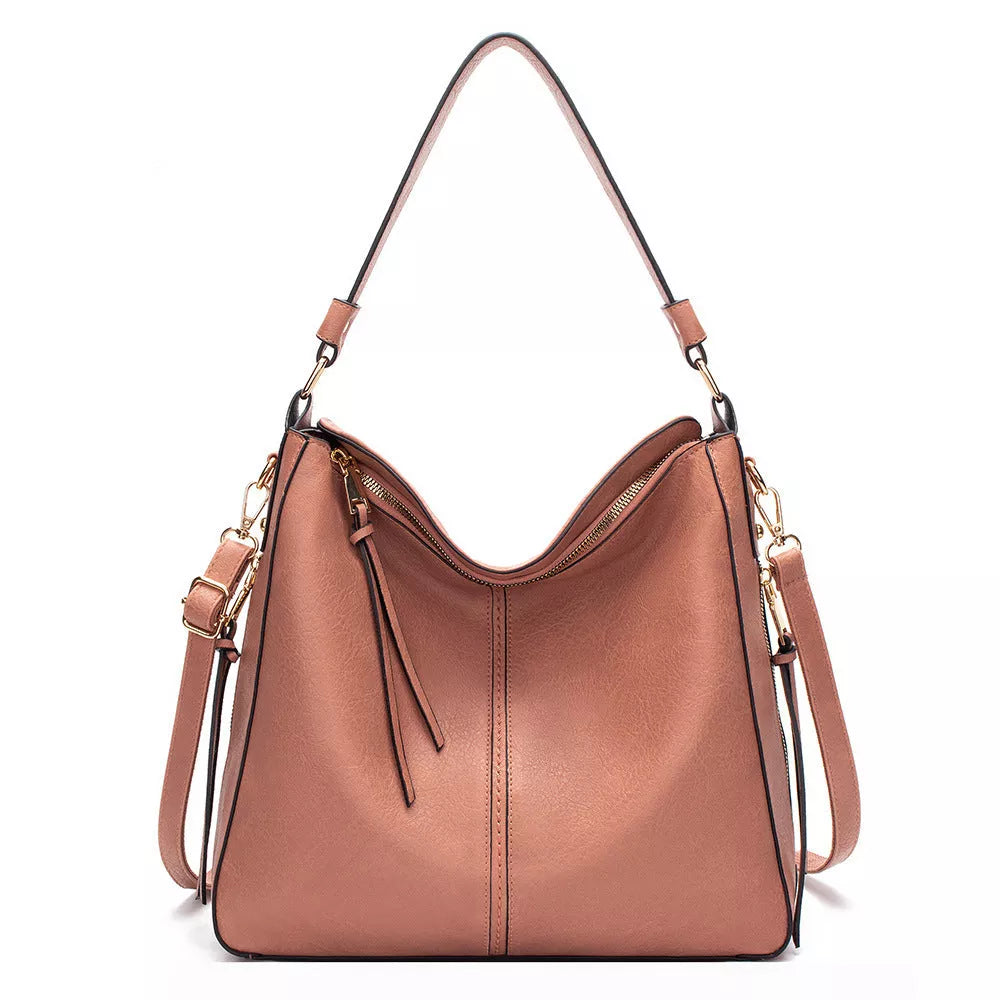 Women's hobo bag in PU material with multiple compartments and a zipper opening