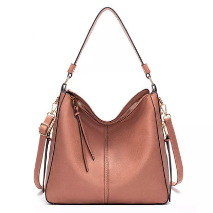 Women's hobo bag in PU material with multiple compartments and a zipper opening