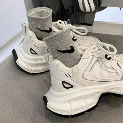 Beige Polar Wave mesh platform trainers with a wedge heel and lace-up front.
