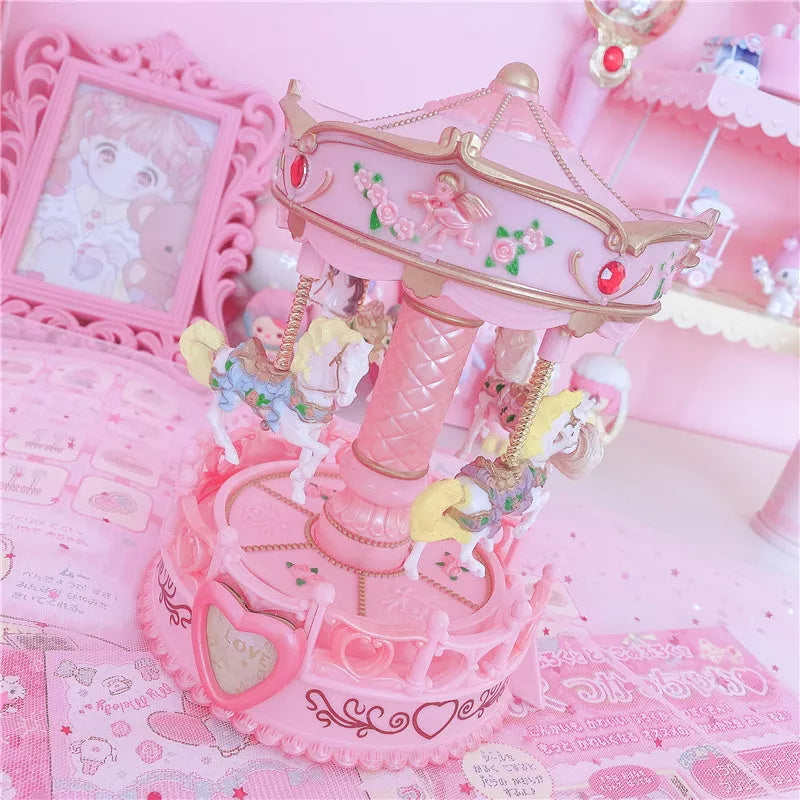 Carousel music box with pink design, clockwork movement, and light, dimensions 15.5x15.5x24 cm