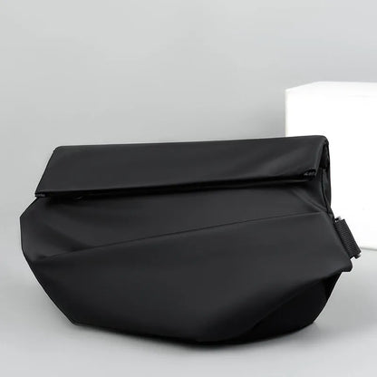 Grey crossbody bag with single shoulder strap showing zipper opening and internal organisation pockets