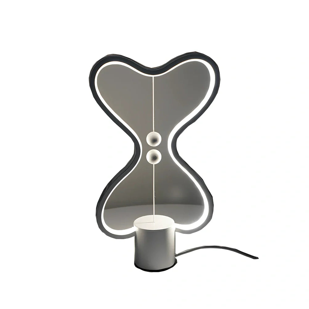 Balance lamp with suspended magnetic netballs and embedded LED lighting in frame