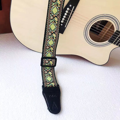 Adjustable embroidered guitar strap with durable webbing and intricate design