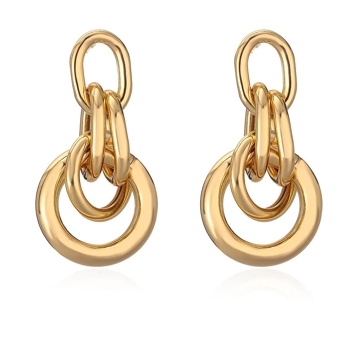 Geometric gold-coloured copper earrings with irregular asymmetric design