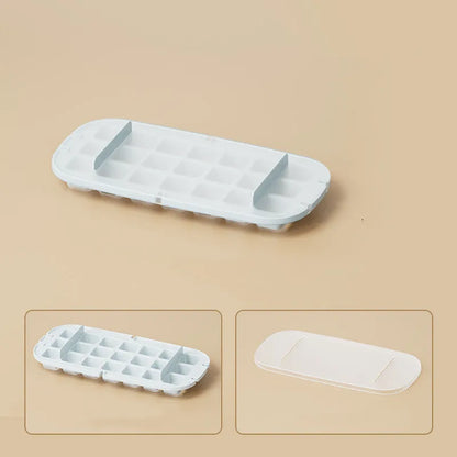 Yellow and blue food grade plastic ice cube trays with ice shovel stored in dedicated slot