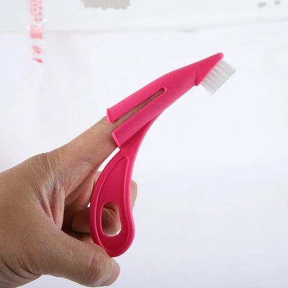 Red and white pet finger toothbrushes with soft silicone bristles for cleaning dog and cat teeth.