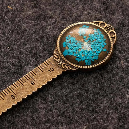 12cm handmade dried flower bookmark with gypsophila ruler featuring lace flowers, daffodils, and clover on blue background