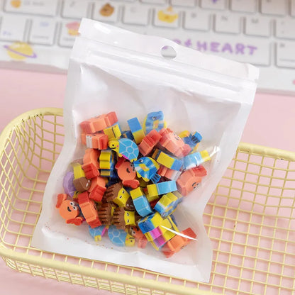 Assortment of 50 small cartoon erasers in pearlescent bags, showing fruit, animal, and holiday designs.