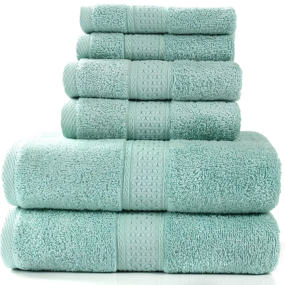 Cotton towel set showing bath towel, hand towel, and face cloth in coordinated sizes
