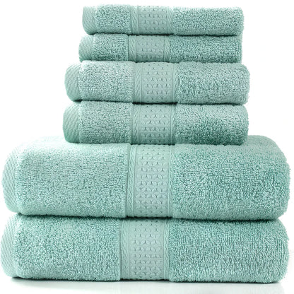 Cotton towel set showing bath towel, hand towel, and face cloth in coordinated sizes