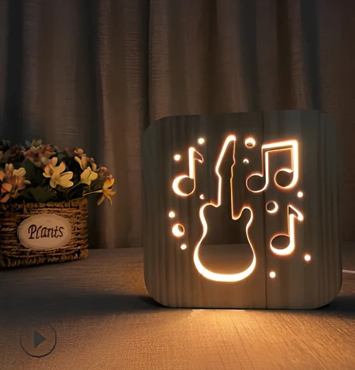 Wood-carved music instrument LED night light with USB cable showing guitar, saxophone, and violin designs