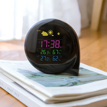 Smart weather forecast clock showing temperature, humidity, and weather conditions with wireless outdoor sensor