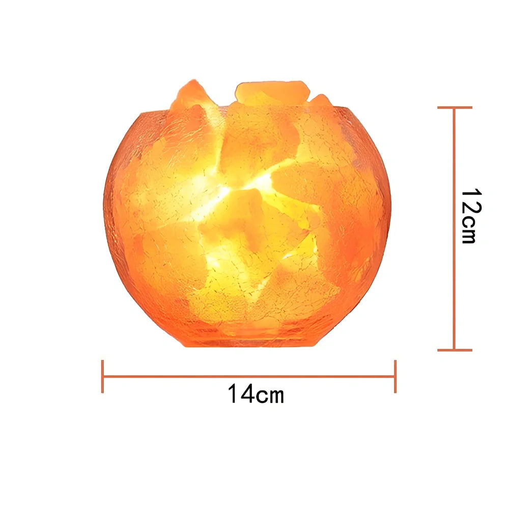 Crystal salt bedside lamp with glass shade and USB cable on wooden table