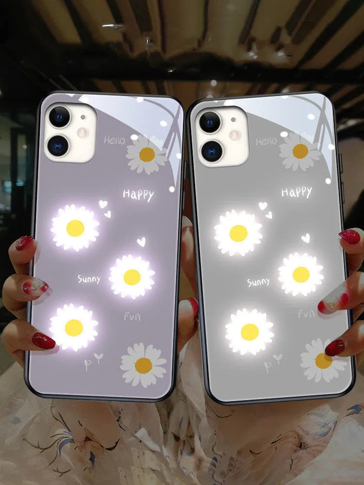 Luminous phone case with voice-activated colour lights showing painted daisy design on Apple iPhone