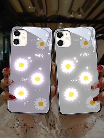 White luminous iPhone case with purple daisy design showing voice-activated colour light illumination around edges