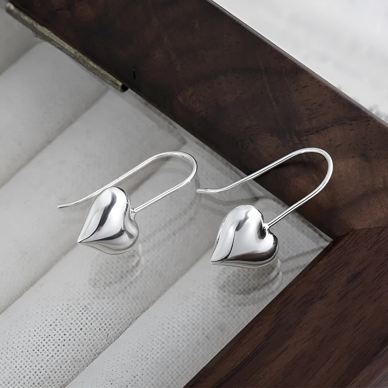 Three-dimensional Glossy Love Cute Sister Earrings: Heart-shaped copper ear hooks with Korean style design for female wearers, featuring a silver colour option and love-themed elements.