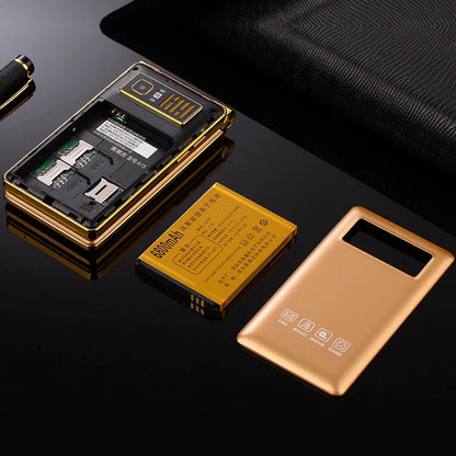Black dual screen flip senior mobile phone showing internal touch display and external smaller screen