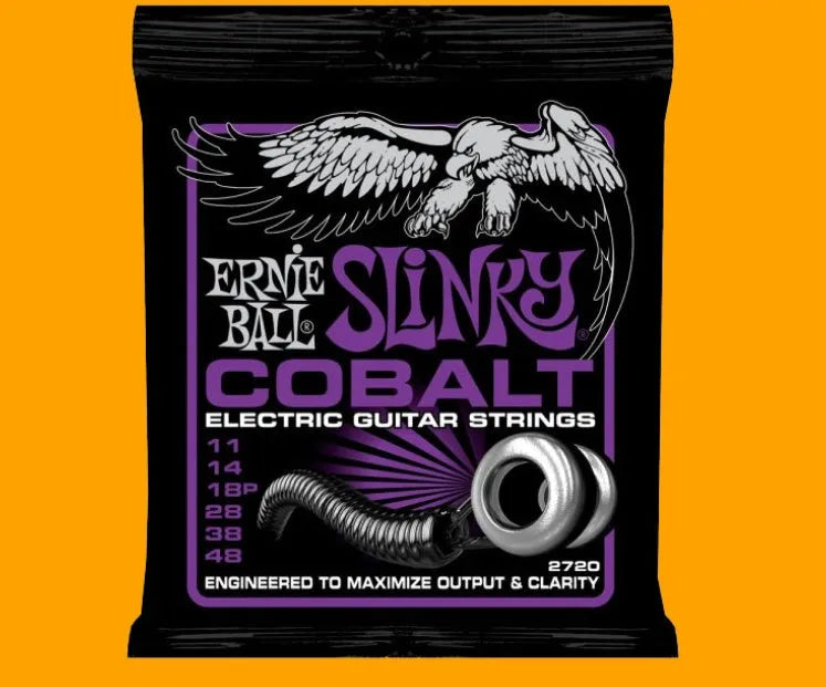 Coils of nickel-plated electric guitar strings and bass strings showing their metallic shine.