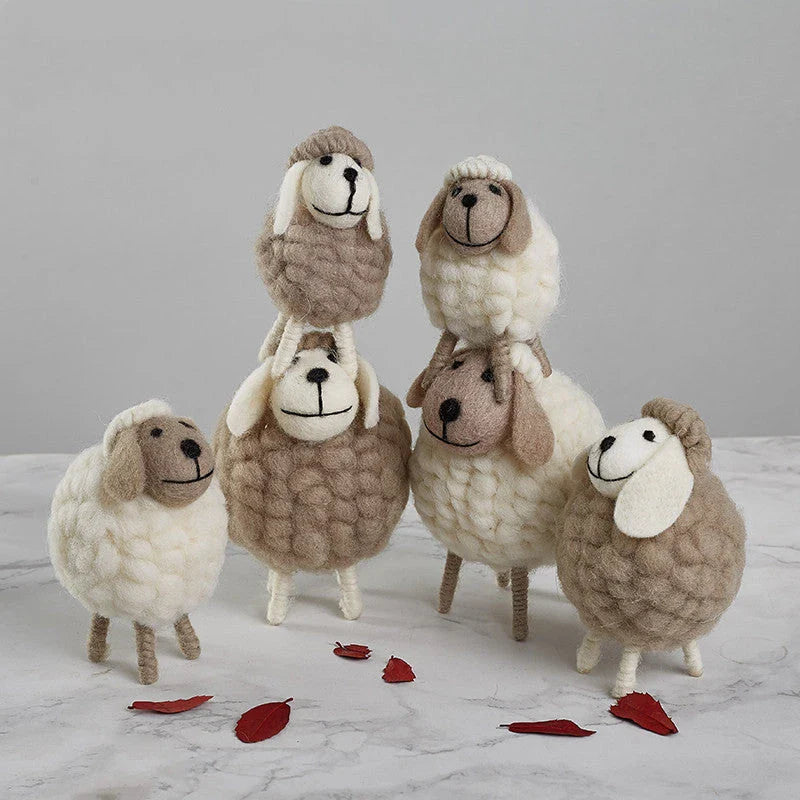 Adorable plush sheep decorations in various sizes and color combinations, perfect for adding a cozy, farmhouse-inspired touch to any home.