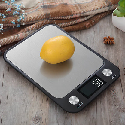 Stainless steel digital kitchen scale with LCD display showing weight measurement