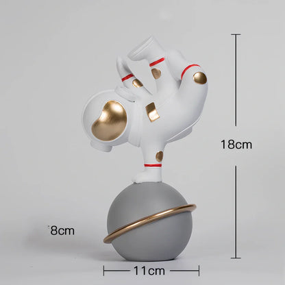 Hand-carved resin astronaut decoration in red or white with handstand, meditate, or skateboard poses