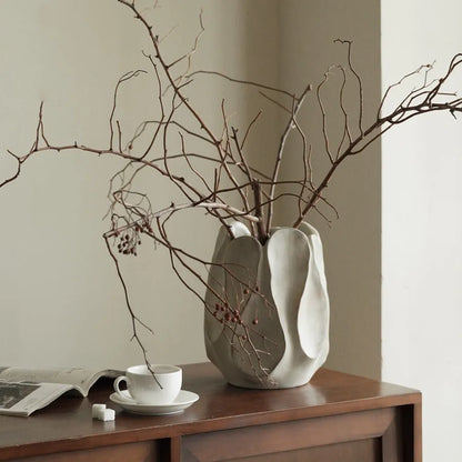 Handcrafted irregular ceramic vase with asymmetrical shape made from magnesium clay for flower arrangements