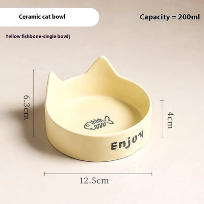 Porcelain cat bowl with anti-tumble wooden frame in pink with a cat paw design