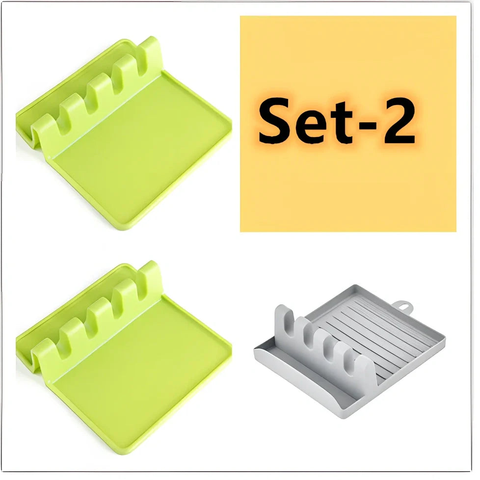 Green silicone spatula holder with four slots for kitchen utensils on countertop