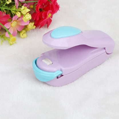 Mini hand pressure heat sealing machine measuring 10cm with magnetic base for plastic bag food preservation