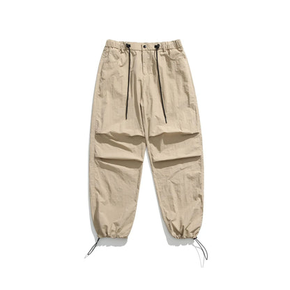Men's loose straight-leg casual pants in thin ice silk fabric shown in black colour