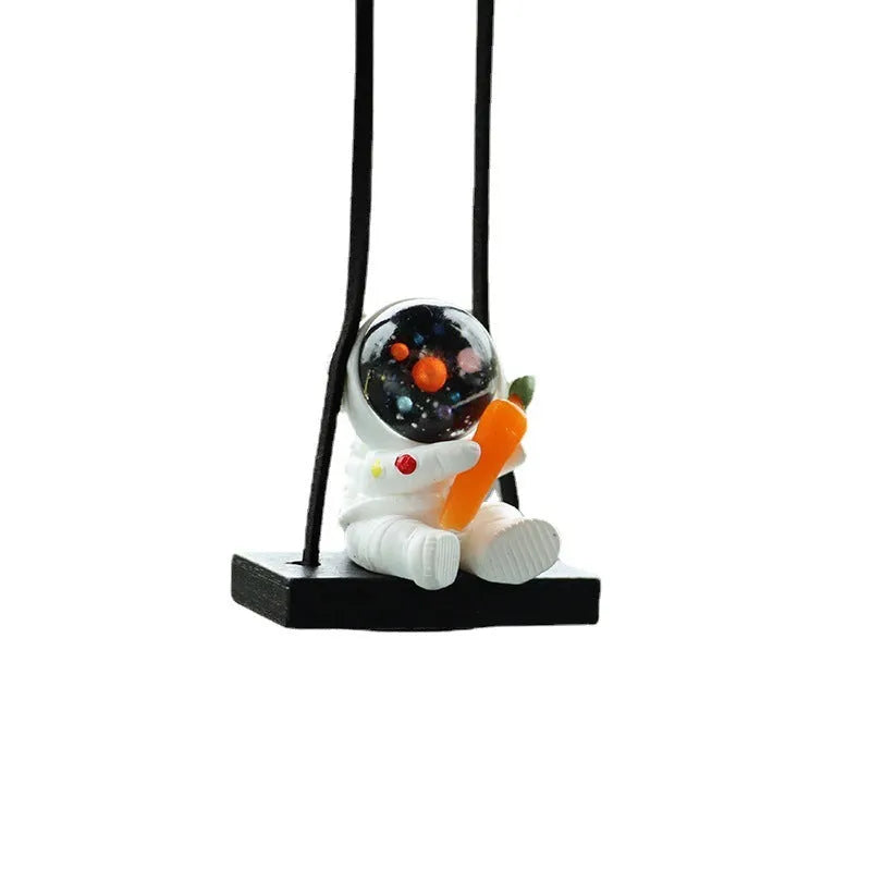 Colourful resin astronaut car pendant ornament with cartoon spaceman design on car dashboard