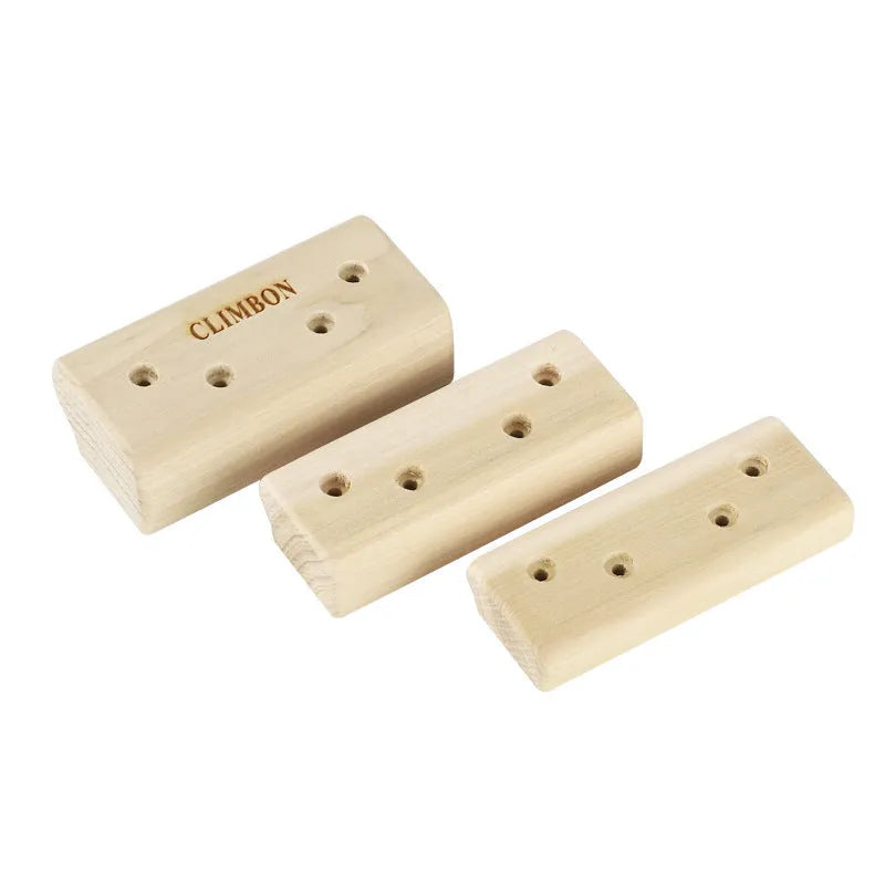 Three solid wood hangboards for grip strength training showing different edge depths and lengths