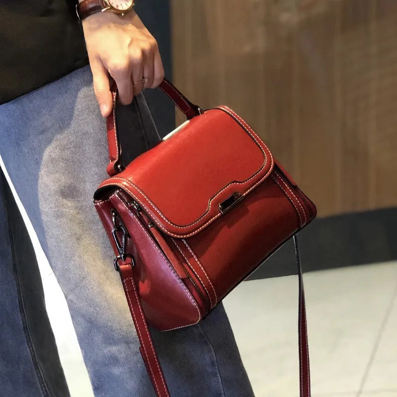 Women's genuine leather retro messenger bag in horizontal square shape with multiple internal compartments